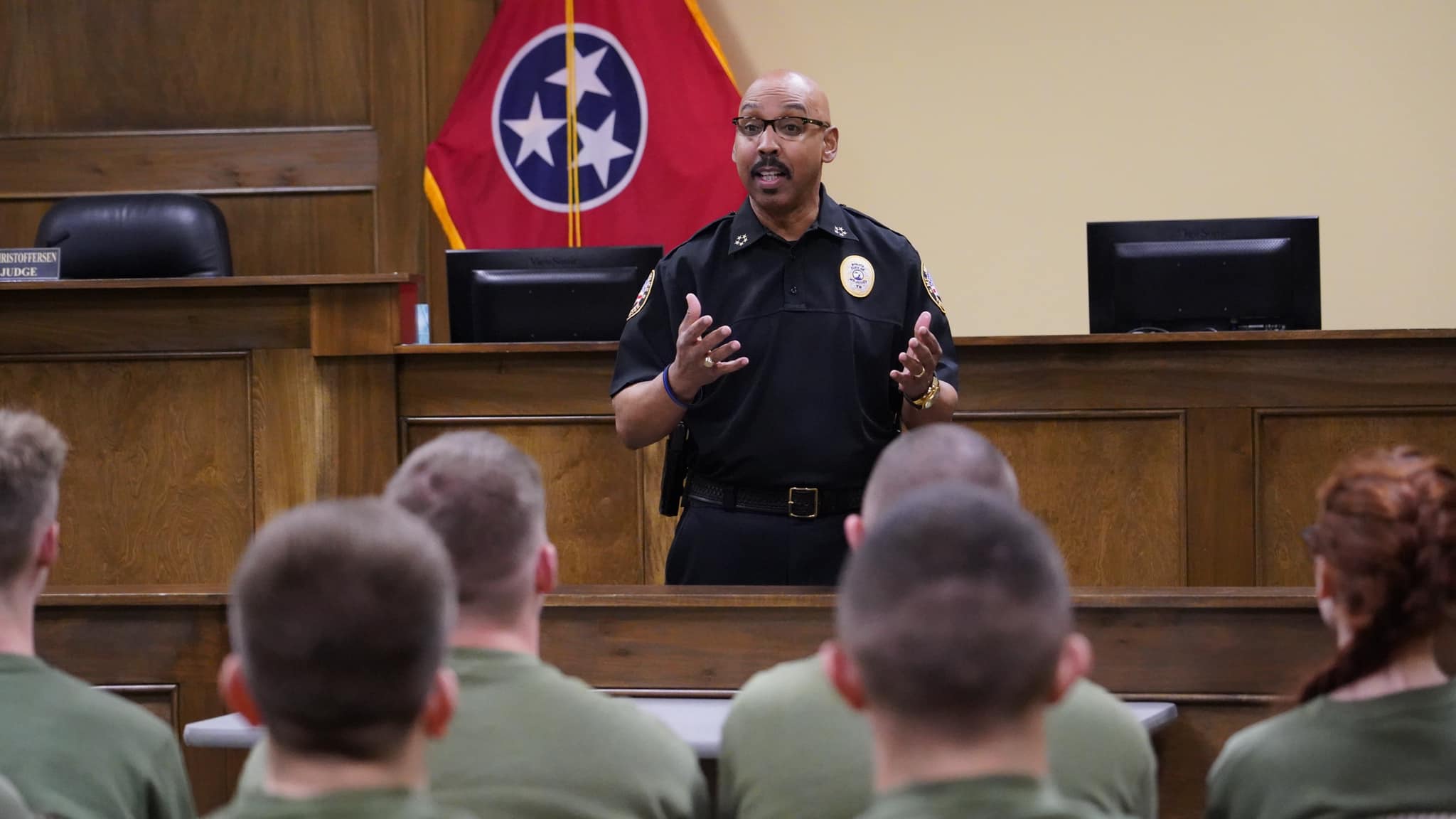 Police officer speaking during training