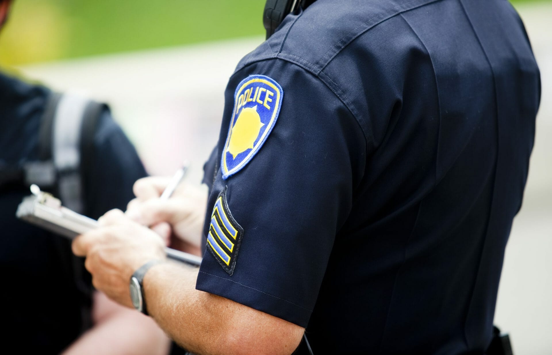 Police officer writing citation